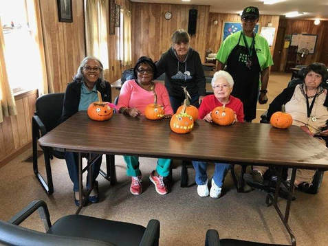 Seniors with pumpkins